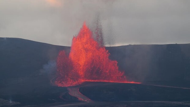 View of a volcanic eruption with glowing lava United States.