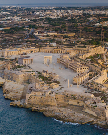Aerial view of the historic Fort Manoel with its central parade ground stone fortifications and surrounding sea in Valletta Port Region Malta. Aerial view of the historic Fort Manoel with its central parade ground stone fortifications and surrounding sea in Valletta Port Region Malta.