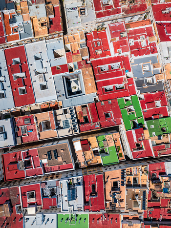 Aerial view of colorful rooftops and building terraces in a dense urban area in Andalusia Spain. Aerial view of colorful rooftops and building terraces in a dense urban area in Andalusia Spain.
