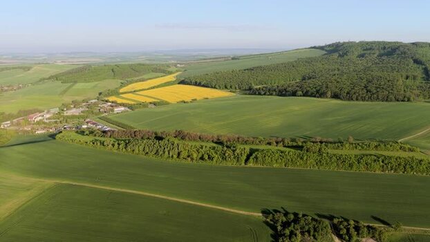 Aerial view of rolling green hills and agricultural fields Czechia. Aerial view of rolling green hills and agricultural fields Czechia.