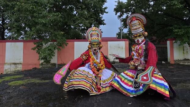 View of Kathakali dancers in traditional costumes and makeup India.