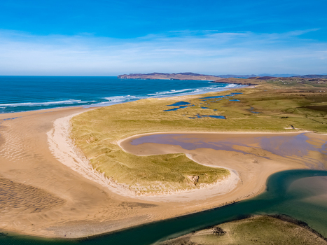 Aerial view of Ballyness Bay featuring sandy dunes tidal channels and the Atlantic coastline in Ballyness County Donegal Ireland. Aerial view of Ballyness Bay featuring sandy dunes tidal channels and the Atlantic coastline in Ballyness County Donegal Ireland.