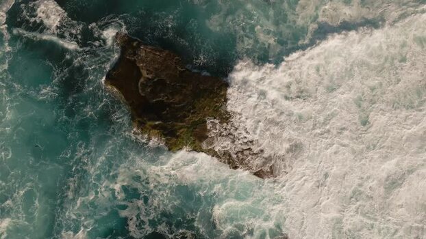 Aerial view of waves crashing on La Jolla Cove rocks United States.