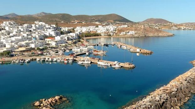 Aerial view of a harbor with white buildings in Greece. Aerial view of a harbor with white buildings in Greece.
