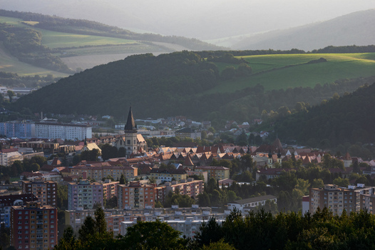Aerial view of the historic town center of Bardejov featuring the Basilica of St. Giles surrounded by red roofed houses and rolling green hills in Bardejov Presov Region Slovakia. Aerial view of the historic town center of Bardejov featuring the Basilica of St. Giles surrounded by red roofed houses and rolling green hills in Bardejov Presov Region Slovakia.