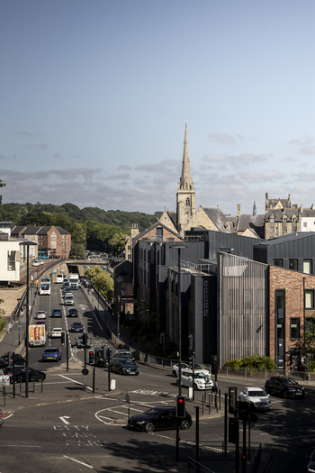 Durham United Kingdom 13 July 2026 View of the historic city of Durham with its iconic cathedral spire rising above modern buildings and busy traffic on a sunny day. Durham United Kingdom 13 July 2026 View of the historic city of Durham with its iconic cathedral spire rising above modern buildings and busy traffic on a sunny day.