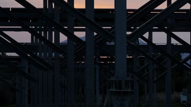 Aerial view of industrial steel structure at sunset Italy.