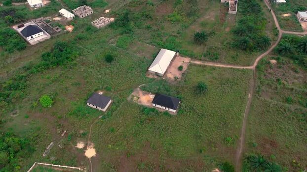 Aerial view of houses amidst trees Nigeria. Aerial view of houses amidst trees Nigeria.