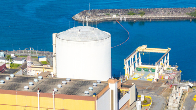 Aerial view of the Nuclear Power Plant Angra 2 with its large white containment dome and industrial facilities situated along the coastline in Angra dos Reis Rio de Janeiro Brazil.