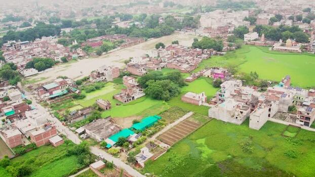 Aerial view of solar scheme in residential area India.