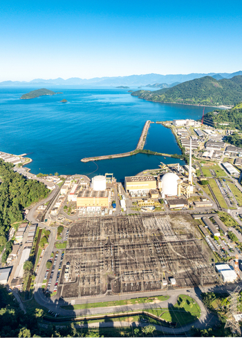 Aerial view of Nuclear Power Plant Angra 2 with its large electrical substation and industrial facilities along the coastline in Angra dos Reis Rio de Janeiro Brazil.