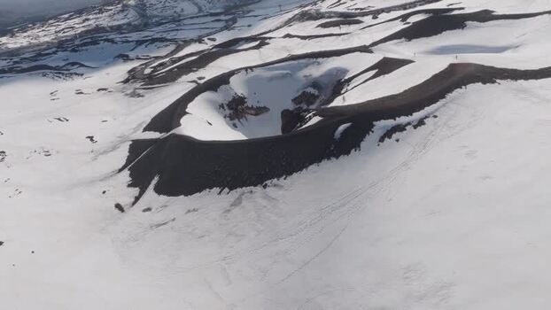 Aerial view of the snow covered volcanic crater near Rifugio Sapienza Italy. Aerial view of the snow covered volcanic crater near Rifugio Sapienza Italy.