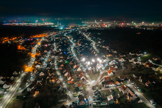 Aerial view of Forchheim at night with fireworks exploding over illuminated residential houses and streetlights in Forchheim Bavaria Germany. Aerial view of Forchheim at night with fireworks exploding over illuminated residential houses and streetlights in Forchheim Bavaria Germany.