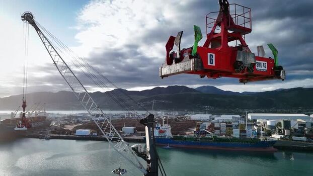 Aerial view of a container spreader at Port Nelson New Zealand. Aerial view of a container spreader at Port Nelson New Zealand.