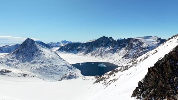 Aerial view of snow covered mountains and fjords Greenland. Aerial view of snow covered mountains and fjords Greenland.