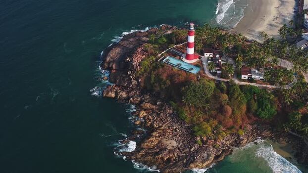 Aerial view of Vizhinjam Lighthouse on a rocky cliff India. Aerial view of Vizhinjam Lighthouse on a rocky cliff India.