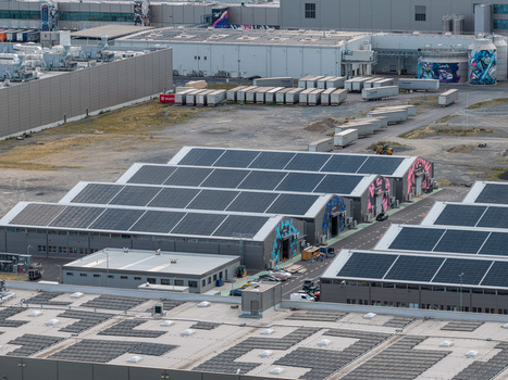Aerial view of the Tesla Gigafactory Berlin Brandenburg with extensive solar panel installations on industrial rooftops and a logistics yard in Grunheide Brandenburg Germany. Aerial view of the Tesla Gigafactory Berlin Brandenburg with extensive solar panel installations on industrial rooftops and a logistics yard in Grunheide Brandenburg Germany.