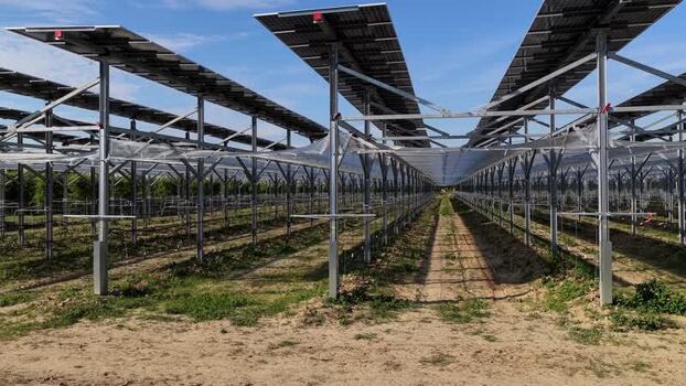 Aerial view of agrivoltaic system in a rural field Italy.