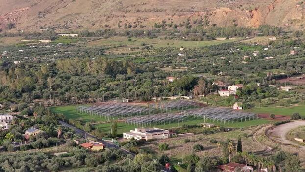 Aerial view of solar farm in rural landscape Italy.