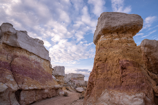 View of the colorful hoodoos and geological formations at Paint Mines Interpretive Park under a cloudy sky in Calhan Colorado United States.
