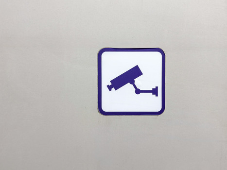 View of a square CCTV surveillance camera sign mounted on a plain neutral wall Sariyer Istanbul Turkiye.