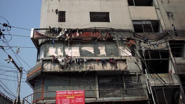 View of a fire damaged building with charred walls in Dhaka Bangladesh. View of a fire damaged building with charred walls in Dhaka Bangladesh.