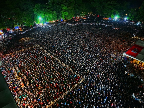 Dhaka Bangladesh 20 July 2026 Aerial view of a massive crowd gathered at Mohsin Hall Playground at night illuminated by stage lights and surrounded by trees. Dhaka Bangladesh 20 July 2026 Aerial view of a massive crowd gathered at Mohsin Hall Playground at night illuminated by stage lights and surrounded by trees.