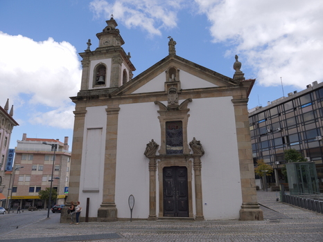 View of the historic Igreja da Misericordia da Covilha with its stone facade and bell tower under a blue sky in Covilha Castelo Branco District Portugal.