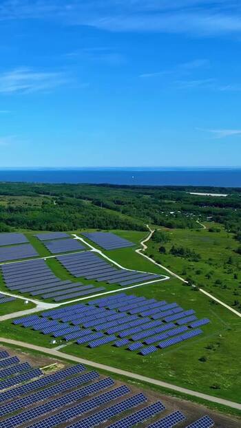 Aerial view of solar farm panels in green fields Estonia. Aerial view of solar farm panels in green fields Estonia.