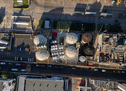 Aerial view of beer industrial complex with large storage tanks processing facilities and parked vehicles in Santo Domingo Dominican Republic. Aerial view of beer industrial complex with large storage tanks processing facilities and parked vehicles in Santo Domingo Dominican Republic.