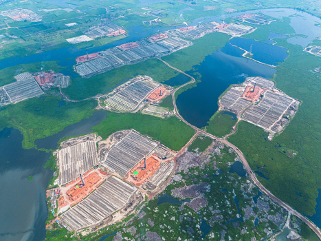 Aerial view of geometric fields interspersed with dark waterways and lush greenery creates a captivating landscape Dhaka Dhaka Division Bangladesh. Aerial view of geometric fields interspersed with dark waterways and lush greenery creates a captivating landscape Dhaka Dhaka Division Bangladesh.