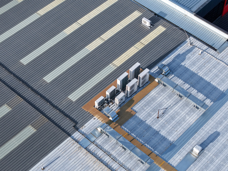 Melbourne Australia 22 September 2026 Aerial view of an industrial factory roof in Kilsyth featuring multiple HVAC units and metal roofing panels. Melbourne Australia 22 September 2026 Aerial view of an industrial factory roof in Kilsyth featuring multiple HVAC units and metal roofing panels.