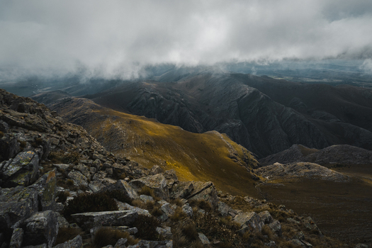 View of rugged mountain slopes and rocky terrain under a dramatic cloudy sky in Sierra de La Ventana Buenos Aires Province Argentina. View of rugged mountain slopes and rocky terrain under a dramatic cloudy sky in Sierra de La Ventana Buenos Aires Province Argentina.