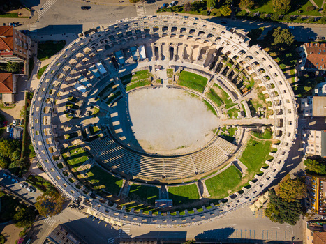 Aerial view of the majestic Pula Arena amphitheater a testament to ancient Roman architecture standing proudly against the urban landscape Pula Istria County Croatia.