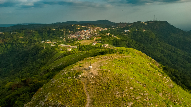 Aerial view of the cross on the summit of Mt. Gemi overlooking the village of Amedzofe Volta Region Ghana. Aerial view of the cross on the summit of Mt. Gemi overlooking the village of Amedzofe Volta Region Ghana.