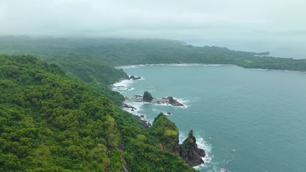 Aerial view of Bukit Pengilon cliffs and coastline Indonesia.