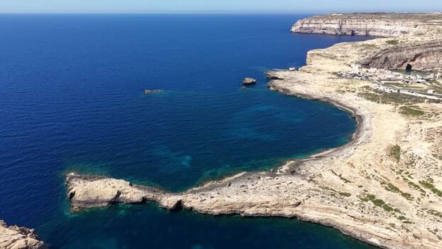 Aerial view of Dwejra Bay and rocky cliffs in Gozo region Malta. Aerial view of Dwejra Bay and rocky cliffs in Gozo region Malta.