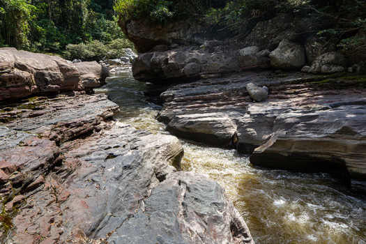 View of Estrecho del Rio Magdalena a narrow river gorge with layered rock formations and lush vegetation in San Agustin Huila Colombia.