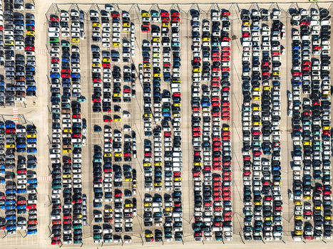 Aerial view of hundreds of colorful cars parked in neat rows at a large logistics hub or factory lot Rivalta di Torino Piedmont Italy. Aerial view of hundreds of colorful cars parked in neat rows at a large logistics hub or factory lot Rivalta di Torino Piedmont Italy.