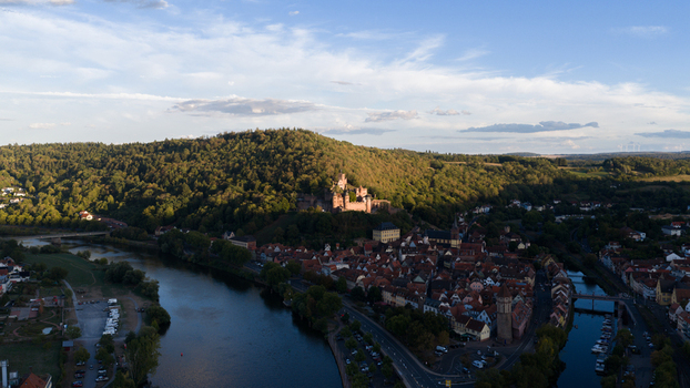 Aerial view of Wertheim Castle overlooking the historic town of Wertheim situated along the river Main surrounded by forested hills in Wertheim Baden Wurttemberg Germany. Aerial view of Wertheim Castle overlooking the historic town of Wertheim situated along the river Main surrounded by forested hills in Wertheim Baden Wurttemberg Germany.