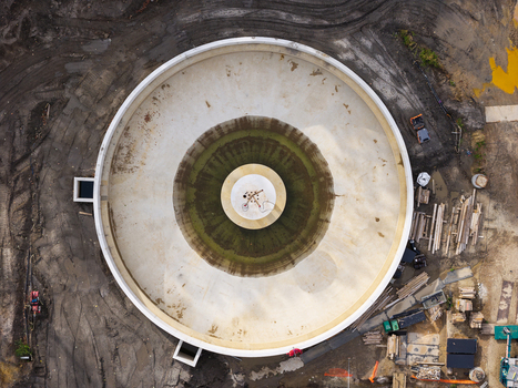 Diepenbeek Flanders Belgium 30 August 2026 Aerial view of a circular wastewater treatment tank under construction surrounded by muddy ground and construction materials. Diepenbeek Flanders Belgium 30 August 2026 Aerial view of a circular wastewater treatment tank under construction surrounded by muddy ground and construction materials.