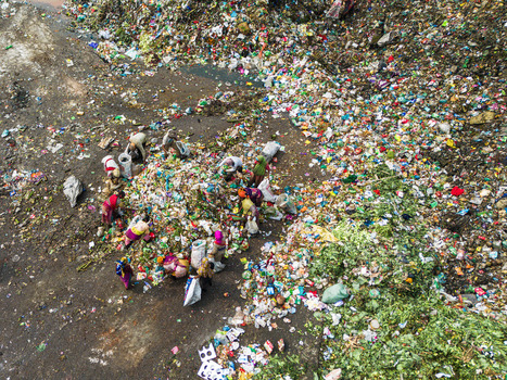 Aminbazar Bangladesh 26 January 2025 Aerial view of waste pickers sorting through colorful plastic and organic garbage at the Aminbazar landfill. Aminbazar Bangladesh 26 January 2025 Aerial view of waste pickers sorting through colorful plastic and organic garbage at the Aminbazar landfill.