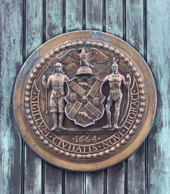 New York United States 14 May 2026 View of the bronze Seal of the City of New York mounted on a weathered green copper door at Grand Central Terminal. New York United States 14 May 2026 View of the bronze Seal of the City of New York mounted on a weathered green copper door at Grand Central Terminal.