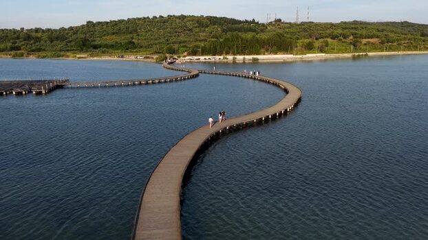 Aerial view of the winding wooden bridge over Narta Lagoon Albania.