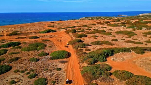 Aerial view of Crete landscape with red dirt paths Greece.