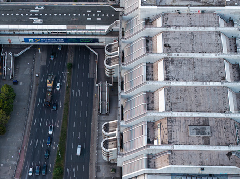 Aerial view of the ICC Berlin featuring its iconic Brutalist architecture and geometric roof structure alongside a busy multi lane highway in Berlin Berlin Germany. Aerial view of the ICC Berlin featuring its iconic Brutalist architecture and geometric roof structure alongside a busy multi lane highway in Berlin Berlin Germany.
