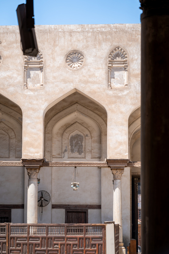 View of the historic Mosque of al Salih Tala i with its ornate pointed arches stone columns and traditional wooden screens Cairo Egypt. View of the historic Mosque of al Salih Tala i with its ornate pointed arches stone columns and traditional wooden screens Cairo Egypt.