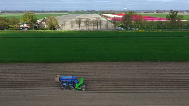Aerial view of a tractor working in a field Netherlands.