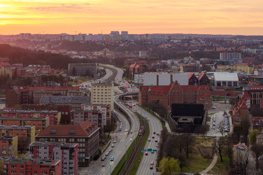 Aerial view of a major road artery with traffic flowing through the historic and modern urban landscape of Gdansk Pomeranian Voivodeship Poland. Aerial view of a major road artery with traffic flowing through the historic and modern urban landscape of Gdansk Pomeranian Voivodeship Poland.
