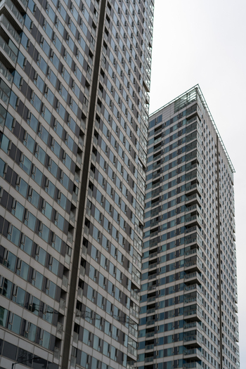 View of modern high rise residential buildings with glass facades and balconies under an overcast sky in Bratislava Bratislava Region Slovakia. View of modern high rise residential buildings with glass facades and balconies under an overcast sky in Bratislava Bratislava Region Slovakia.